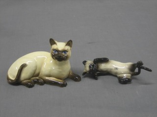 A Beswick figure of a climbing Siamese cat 6" and 1 other of a reclining cat 7"