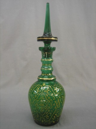 A large and impressive green overlay glass decanter and stopper 19"