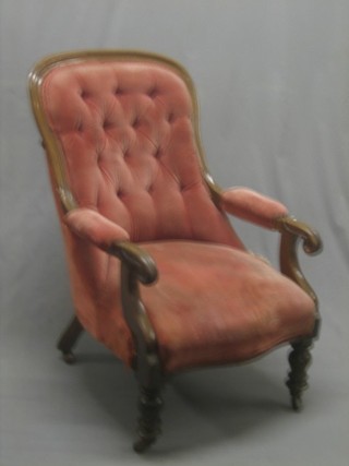A William IV mahogany show frame open arm chair with upholstered seat and back in pink Dralon, raised on turned supports