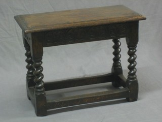 A 19th Century rectangular carved oak joyned stool raised on turned and block supports 23"