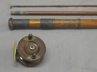 A 19th Century wooden and brass centre pin fishing reel by Alcock 2" together with a wooden 3 section fishing rod