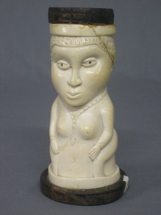 A carved ivory figure of a seated lady (f and r) 8"
