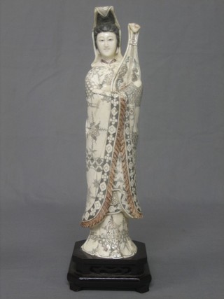 An Oriental carved ivory figure of a standing Geisha Girl 14"