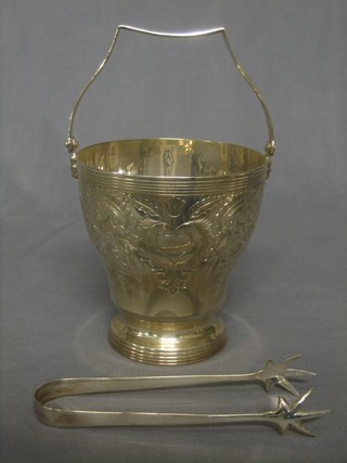 An engraved silver plated ice pail with tongs