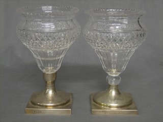 2 19th Century cut glass vases raised on square silver bases, London 1911 8"