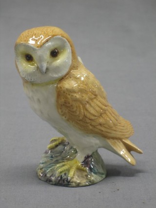 A Beswick figure of a seated owl, the base marked Beswick 5"