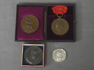 A  bronze 1907 Royal Academy of Music medal, ditto for Improvement, a George bronze Coronation medallion and a 1905 Trafalgar Centenary medallion