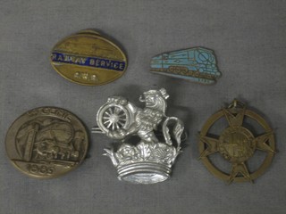 An oval bronze and enamel Great Western Railway Services badge, the reverse marked 58360, a Great Western Railways St Johns Ambulance bronze medal 1916, a white metal badge with locomotive marked 5e GENIE 1889, a British Railways cap badge an enamelled badge in the form of a locomotive marked SR SO