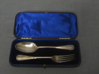A Victorian silver 2 piece Old English and rat tail pattern christening set comprising spoon and fork, London 1892 3 ozs, cased