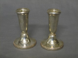 A pair of silver stub shaped candlesticks Birmingham 1961 4"