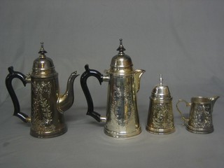 An engraved silver plated cylindrical 4 piece coffee service comprising coffee pot, milk jug, cream jug and sugar bowl 