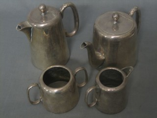 A silver plated 4 piece hotelware tea set with teapot, hotwater jug, cream jug and sugar bowl