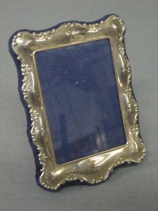 A modern silver easel photograph frame 5" x 4"