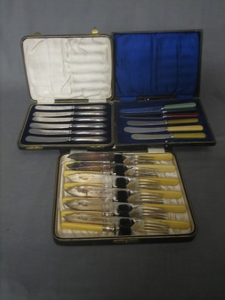 A set of 6 silver plated fish knives and forks and a set of 6 silver handled tea knives, cased