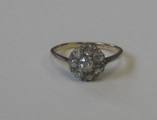 A lady's 18ct gold cluster dress ring set numerous rose cut diamonds
