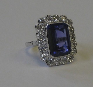 A lady's 18ct white gold dress ring set a rectangular Tanzanite surrounded by numerous diamonds approx 1.80ct/9.10ct