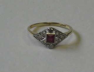 A lady's 18ct yellow gold dress ring set a square ruby surrounded by diamonds