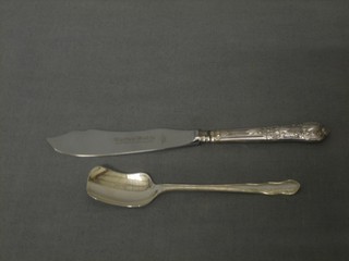 A silver caddy spoon and a silver handled butter knife