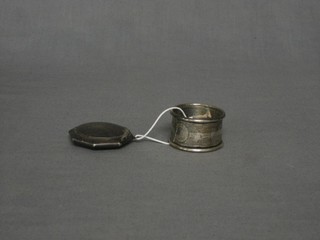 An octagonal silver compact 2" and a silver napkin ring