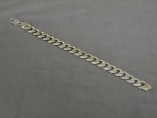A modern Italian flat silver curb link identity bracelet