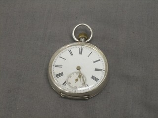 An open faced pocket watch with enamelled dial and Roman numerals contained in a silver case