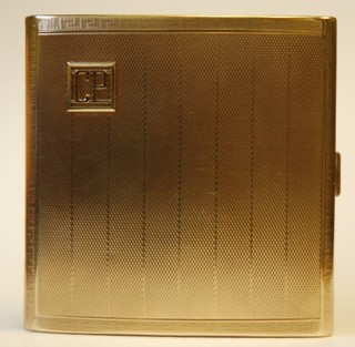A 9ct gold cigarette case with engine turned decoration 117gms