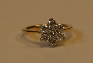 A gold cluster dress ring set diamonds approx. 1.12ct