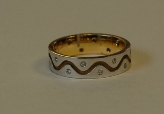 An 18ct yellow and white gold dress ring set diamonds 
