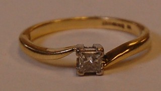 An 18ct gold yellow gold dress ring set a diamond