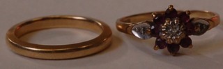 A 9ct gold wedding band and a 9ct gold dress ring set pink and white stones