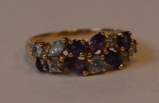 A gold dress ring set coloured precious stones