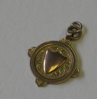 A 9ct gold watch chain medallion