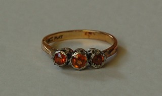 An 18ct gold dress ring set amber coloured stones