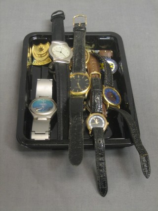 A collection of wristwatches and badges