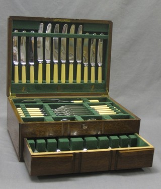 A canteen of Old English pattern silver plated flatware contained in an oak canteen box
