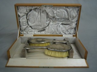 2 silver backed hair brushes contained in an oak case