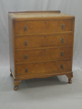 A 1950's Queen Anne style walnut chest of 4 long drawers, raised on cabriole supports 30"