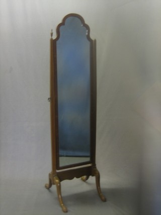 A Queen Anne style shaped plate cheval mirror contained in a walnut swing frame