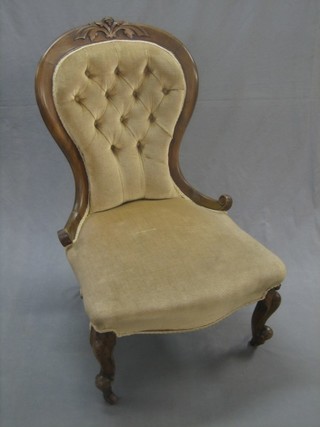 A Victorian mahogany show frame tub back nursing chair upholstered in mushroom buttoned Dralon, raised on cabriole supports