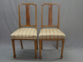 A pair of Edwardian satinwood bedroom chairs