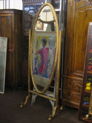 A 19th Century oval bevelled plate cheval mirror contained in a gilt frame and stand 55"