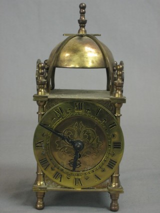 A Smiths reproduction 18th Century lantern clock contained in a brass case 3"