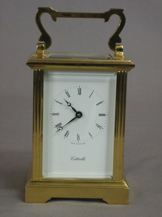 A 20th Century carriage clock with enamelled dial and Roman Numerals 
