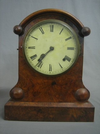 An American 19th Century bracket clock with 7" circular dial contained in an arched figured walnut case