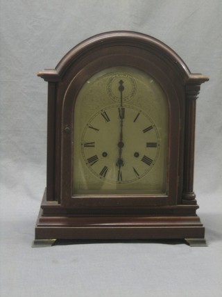 A 19th Century Continental chiming bracket clock with arch shaped silvered dial and Roman Numerals by Gustaav Becker, contained in a dome mahogany case