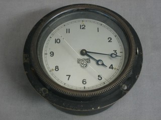 A Smiths 8 day car clock, the 2 1/2" circular silvered dial with Arabic numerals (crack to glass)