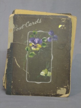 A card postcard album containing a collection of WWI embroidered and black and white postcards
