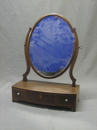 A 19th Century oval plate dressing table mirror contained in a swing frame fitted 1 long and 2 short drawers, raised on bracket feet 17"