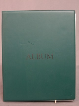 A green loose leaf album containing various railway and omnibus tickets