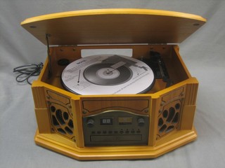 A 1930's style record player/CD player contained in an oak finished case 18"